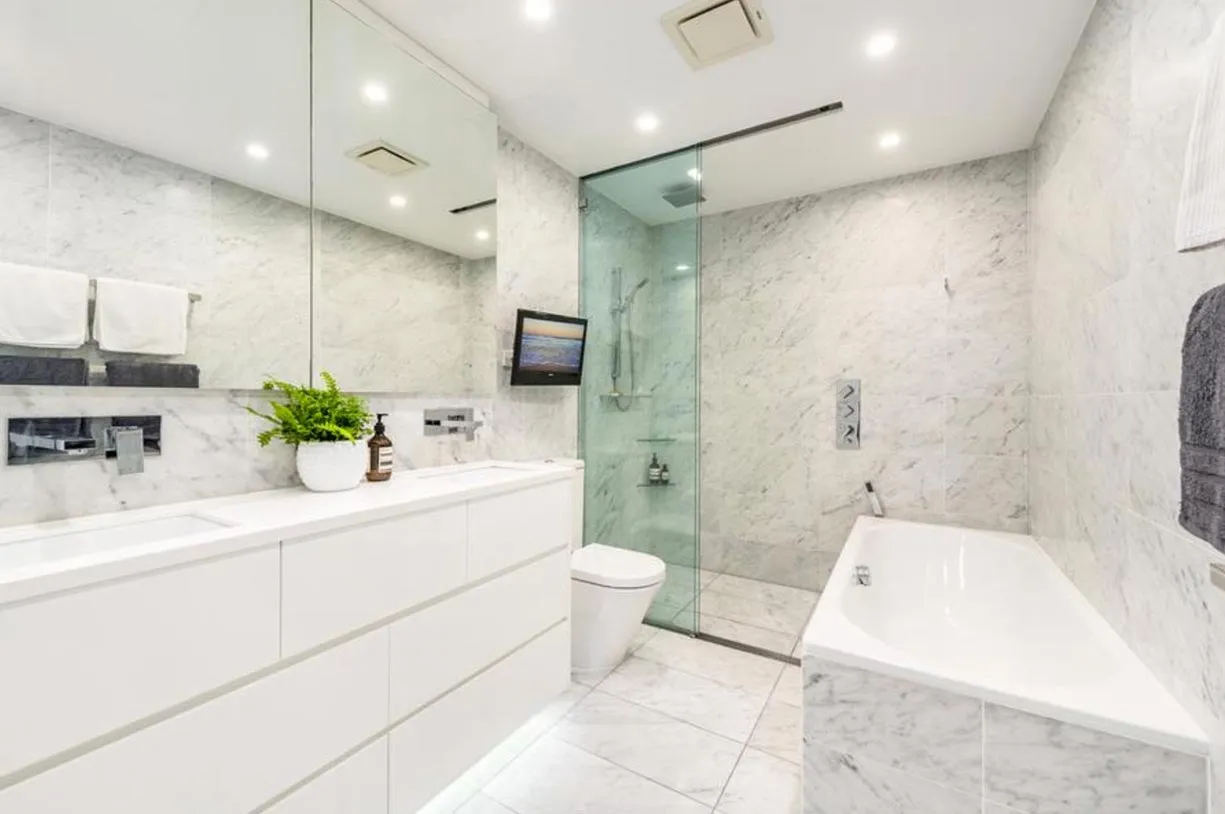 A well-organized laundry room showcasing a washer and dryer, designed for convenience and functionality
